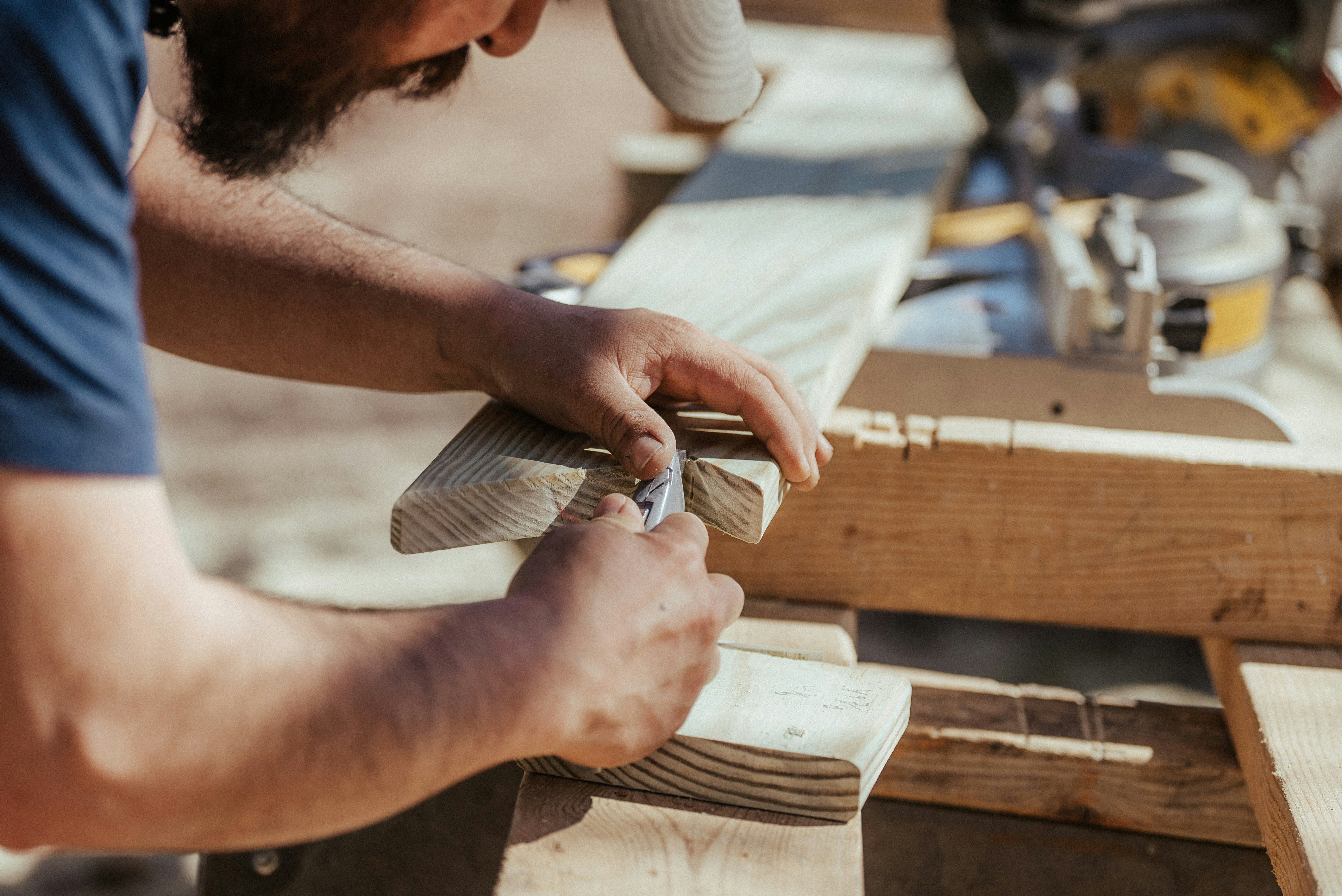 Contractor measuring lumber